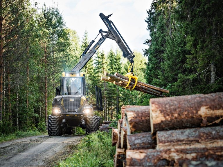 Ponsse forest machine transporting logs through a forest
